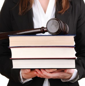 Lawyer Holding a Gavel and Some Books