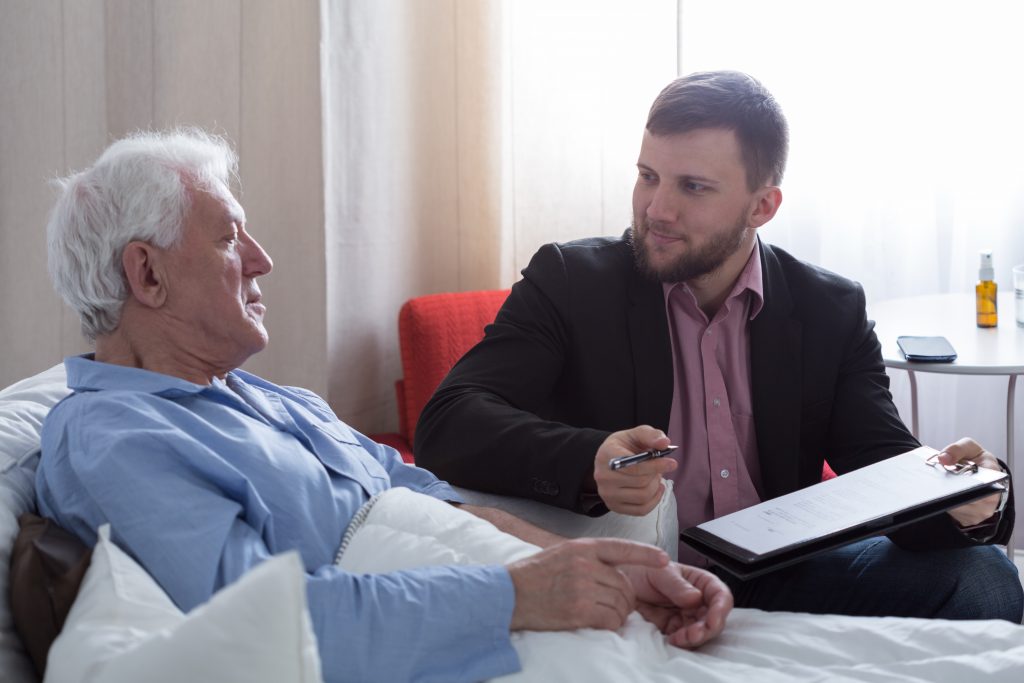 Senior talking to lawyer about his will