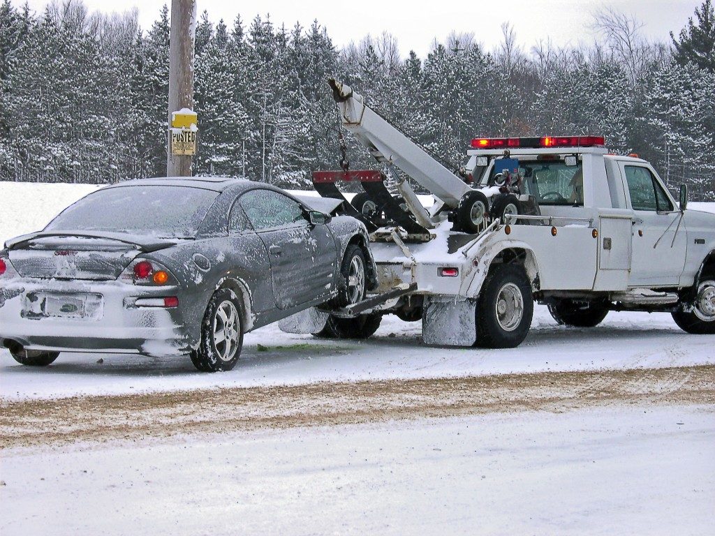 car being towed in snowy weather