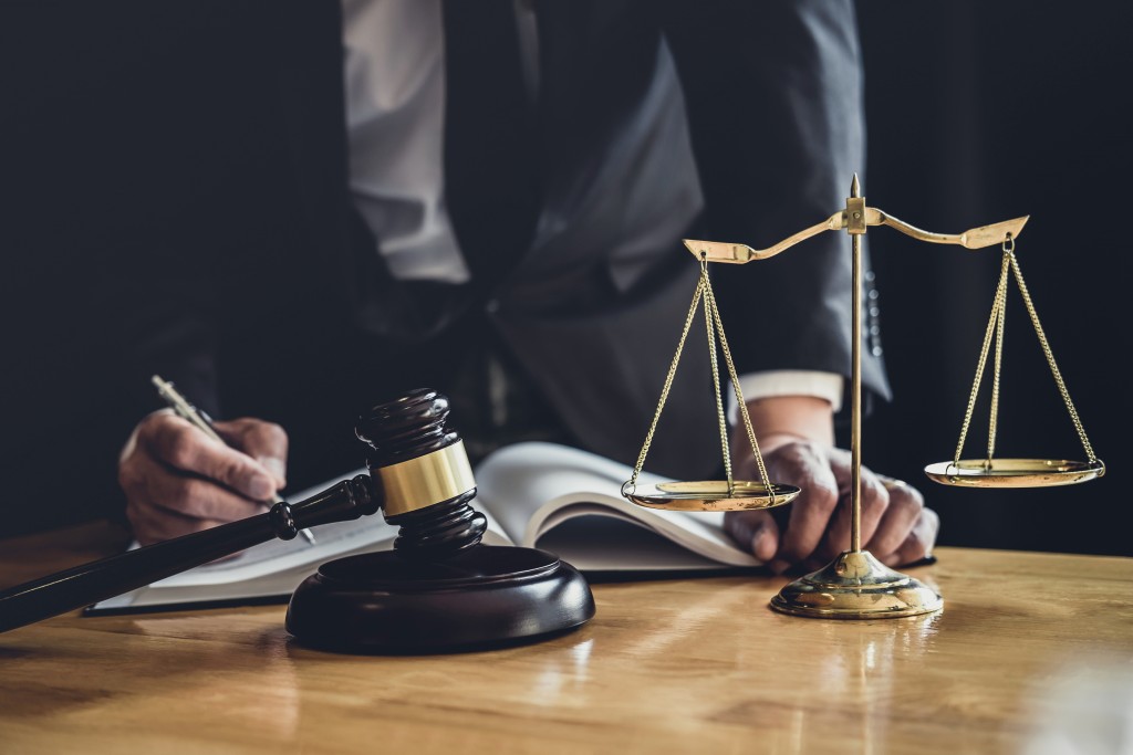 lawyer writing in his office