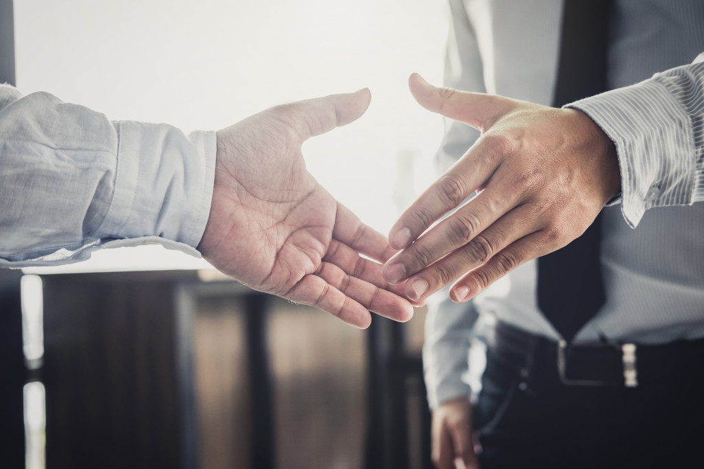 Two businessmen doing a handshake